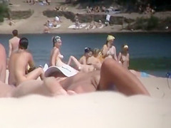 Brunette nudist woman sunbathing