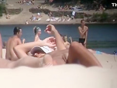 Brunette nudist woman sunbathing