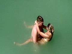 Voyeur notices they fuck in the water