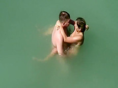 Voyeur notices they fuck in the water