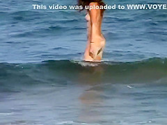 Couple making out on a beach