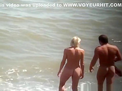 Nudist blonde woman caught in nudist beach
