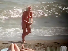 Nudist blonde woman caught in nudist beach