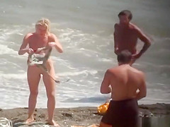 Nudist blonde woman caught in nudist beach