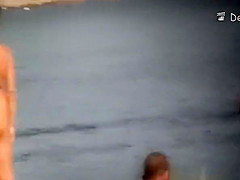 Voyeur at beach films nudists