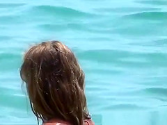 Young woman playing in the sea