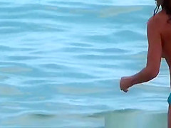 Young woman playing in the sea