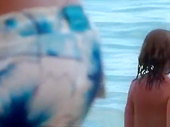 Young woman playing in the sea