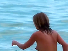 Young woman playing in the sea