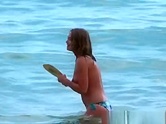 Young woman playing in the sea