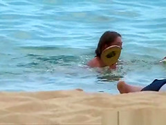 Young woman playing in the sea