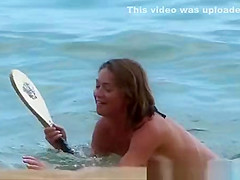 Young woman playing in the sea