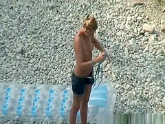 Woman arrives to the beach and undresses
