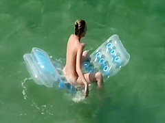 Woman arrives to the beach and undresses