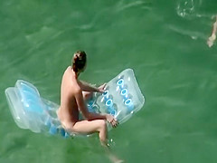Woman arrives to the beach and undresses
