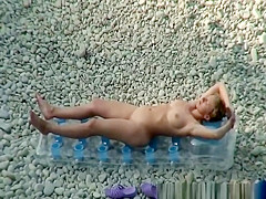 Woman arrives to the beach and undresses