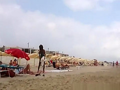 Nudist voyeur walking on the nudist beach