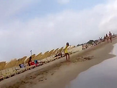 Nudist voyeur walking on the nudist beach