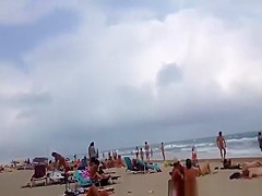 Nudist voyeur walking on the nudist beach