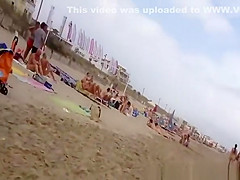 Nudist voyeur walking on the nudist beach