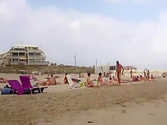 Nudist voyeur walking on the nudist beach