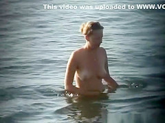 Nudist woman in water