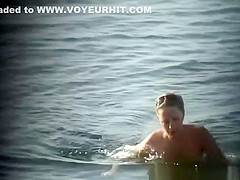 Nudist woman in water