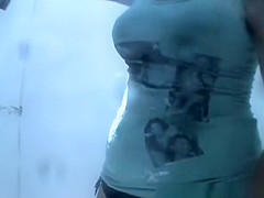 Woman in beach cabin changing from bikini