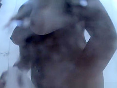 Woman in beach cabin changing from bikini