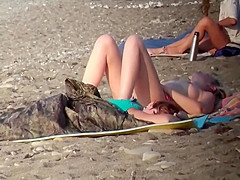 Topless babe voyeured on a beach