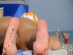 Nudist women spied in the beach sunbathing