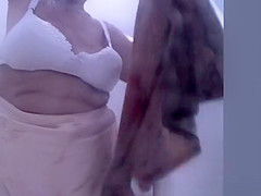 Chubby granny spied in the beach cabin