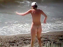 Injured nudist resting by the sea