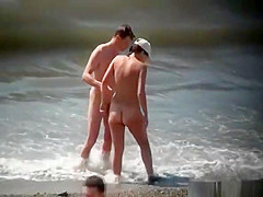 Injured nudist resting by the sea