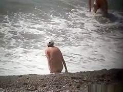 Injured nudist resting by the sea