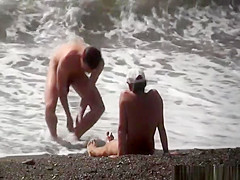 Injured nudist resting by the sea