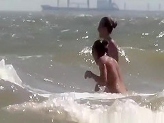 Topless and nude friend at beach