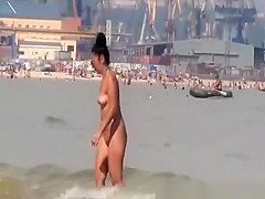 Topless and nude friend at beach