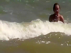 Topless and nude friend at beach
