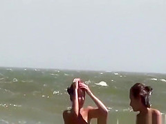 Topless and nude friend at beach