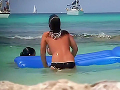 Topless teens having fun in the water