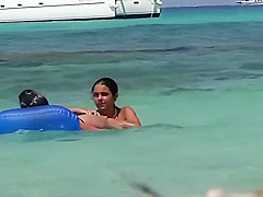 Topless teens having fun in the water