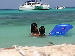 Topless teens having fun in the water