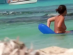 Topless teens having fun in the water