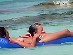 Topless teens having fun in the water