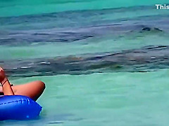 Topless teens having fun in the water