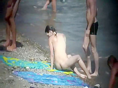 Skinny nude girl creeped on at a beach