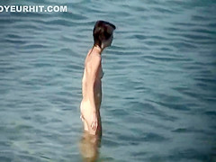 Skinny nude girl creeped on at a beach