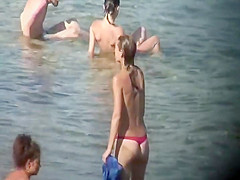 Skinny nude girl creeped on at a beach