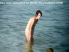 Skinny nude girl creeped on at a beach